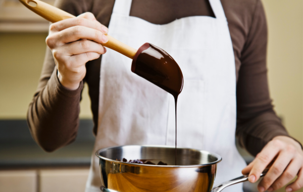 Tempered melted chocolate in mixing bowl